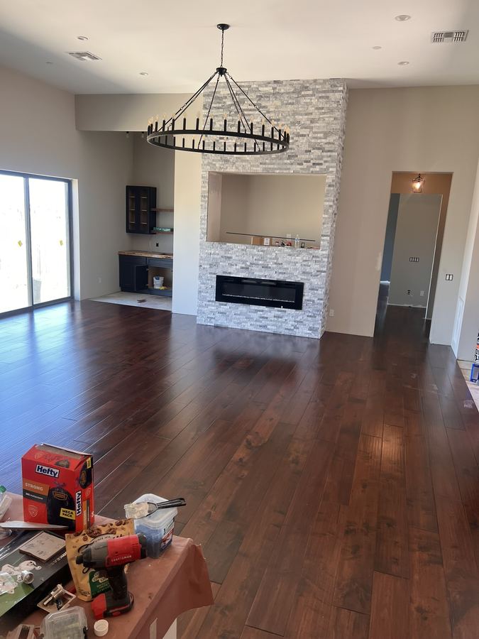 Great room, dark walnut tone with stone fireplace
