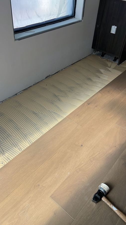 Setting planks along the wall