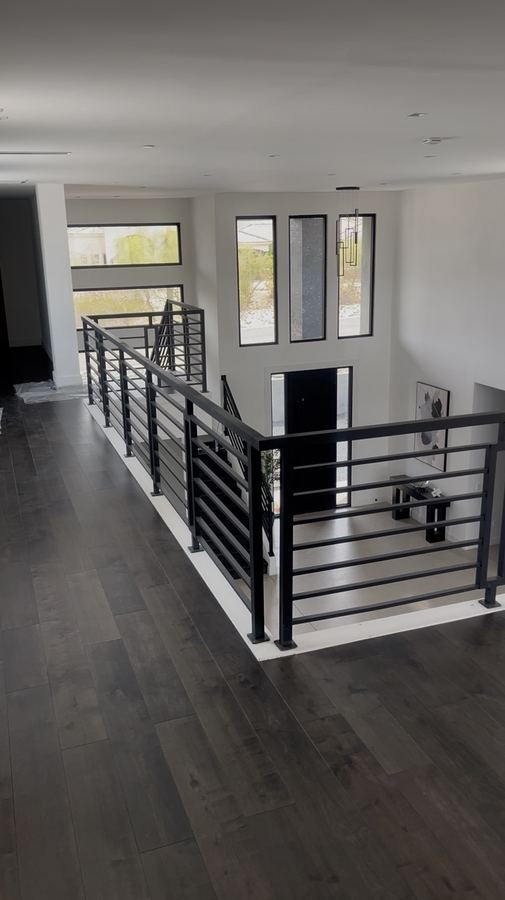 Upper level, charcoal plank with iron railing